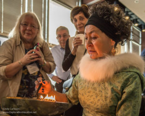 Aaju Peter tending the qulliq (kudlik) 2016 Inuit Art Society Kenosha WI - photo Cindy Carlsson