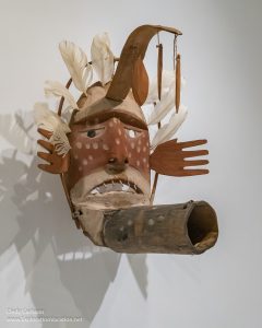 Carved and painted wood Yup’ik Windmaker mask