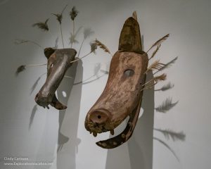 carved wood caribou and wolf masks