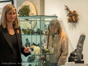 photo of people looking at art in the Inuit Gallery in Vancouver Canada