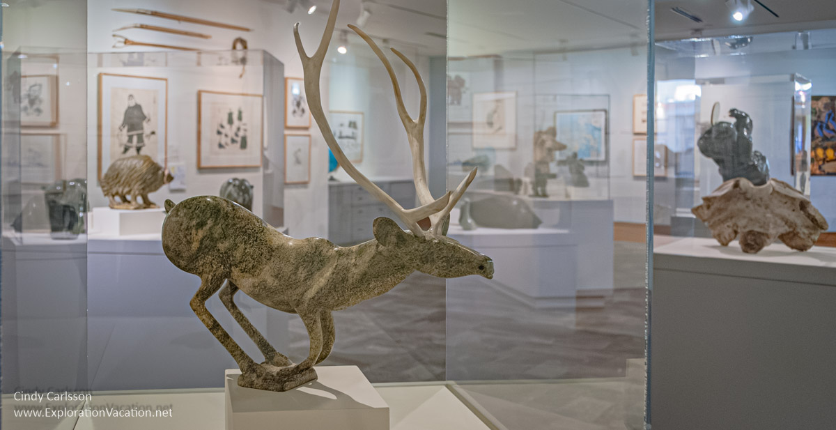 Photo of a caribou carved from stone by Inuit Artist Osuitok Ipeelee in the Inuit gallery at the Dennos Museum Center in Traverse City, Michigan in 2007 © Cindy Carlsson at ExplorationVacation.net