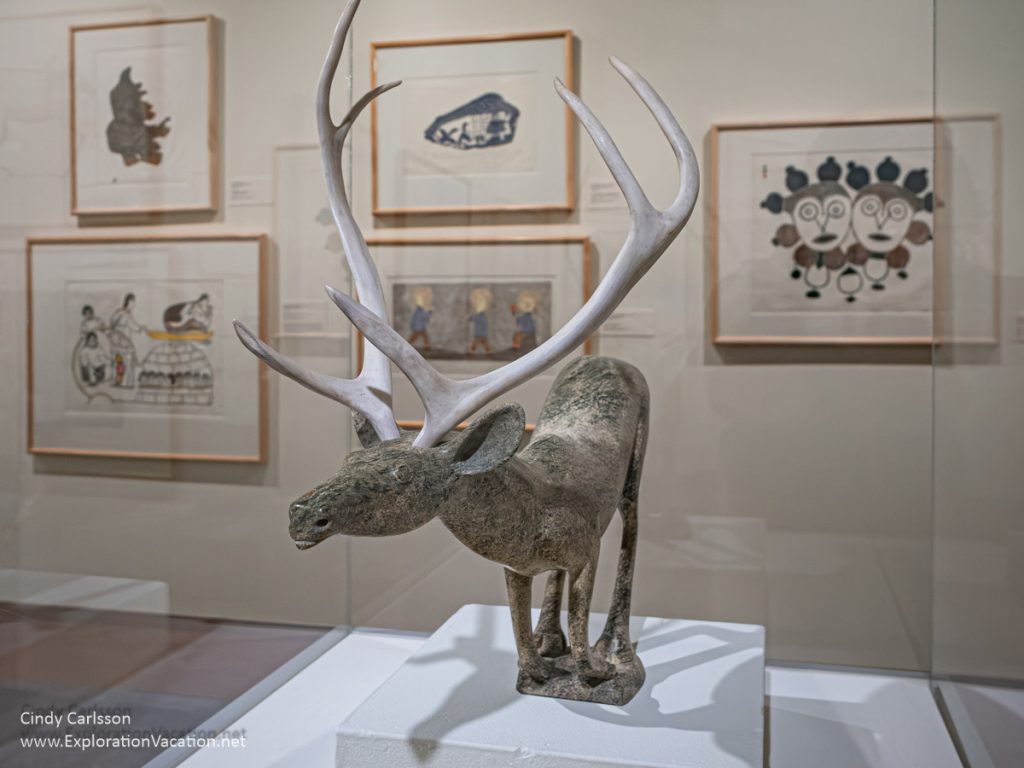 Photo of a caribou carved from stone by Inuit Artist Osuitok Ipeelee in the Inuit gallery at the Dennos Museum Center in Traverse City, Michigan in 2007 © Cindy Carlsson at ExplorationVacation.net