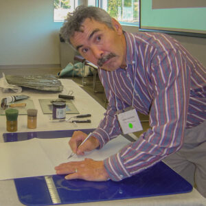 Inuit artist Jimmy Manning demonstrating print-making at the 2010 Inuit Art Society Meeting at Cranbrook Institute of Science in Michigan