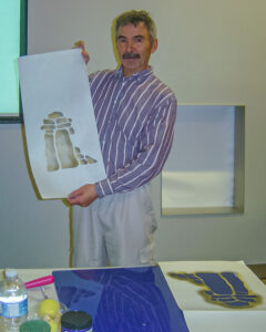 Inuit artist Jimmy Manning demonstrating print-making at the 2010 Inuit Art Society Meeting at Cranbrook Institute of Science in Michigan