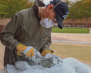 Pootoogook Qiatsuk, a widely exhibited, multi-dimensional artist who creates prints, sculpture, and jewelry at the 2014 Inuit Art Society Meeting in Indianapolis.