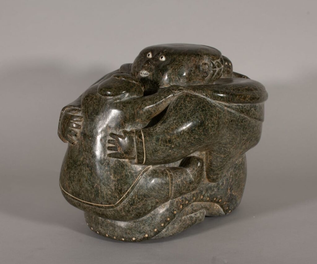 Photo of a sculpture of a mother and child by an unidentified Inuit artist circa 1952. Photo from Galerie Elca London.