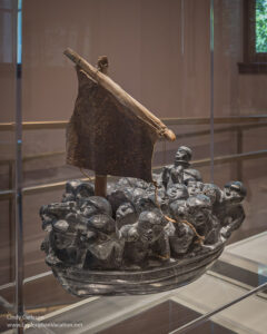 Joe Talirunili, Untitled (Migration) 1964; Steatite, sealskin, bone, synthetic sinew, and paint.