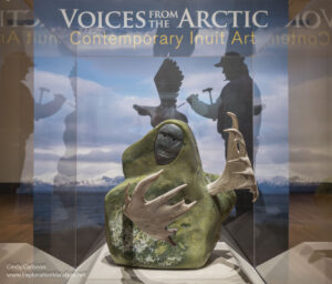 Photo of a sculpture by Mattusie Iyaituk by the Voices from the Arctic gallery entrance