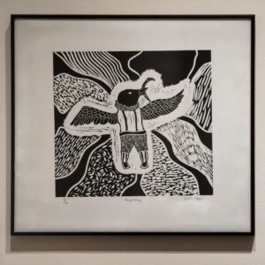 Photo of a print of a winged creature by Pootoogook Qiatsuk called "Angak Kuq" at the Eiteljorg in Indianapolis, Indiana