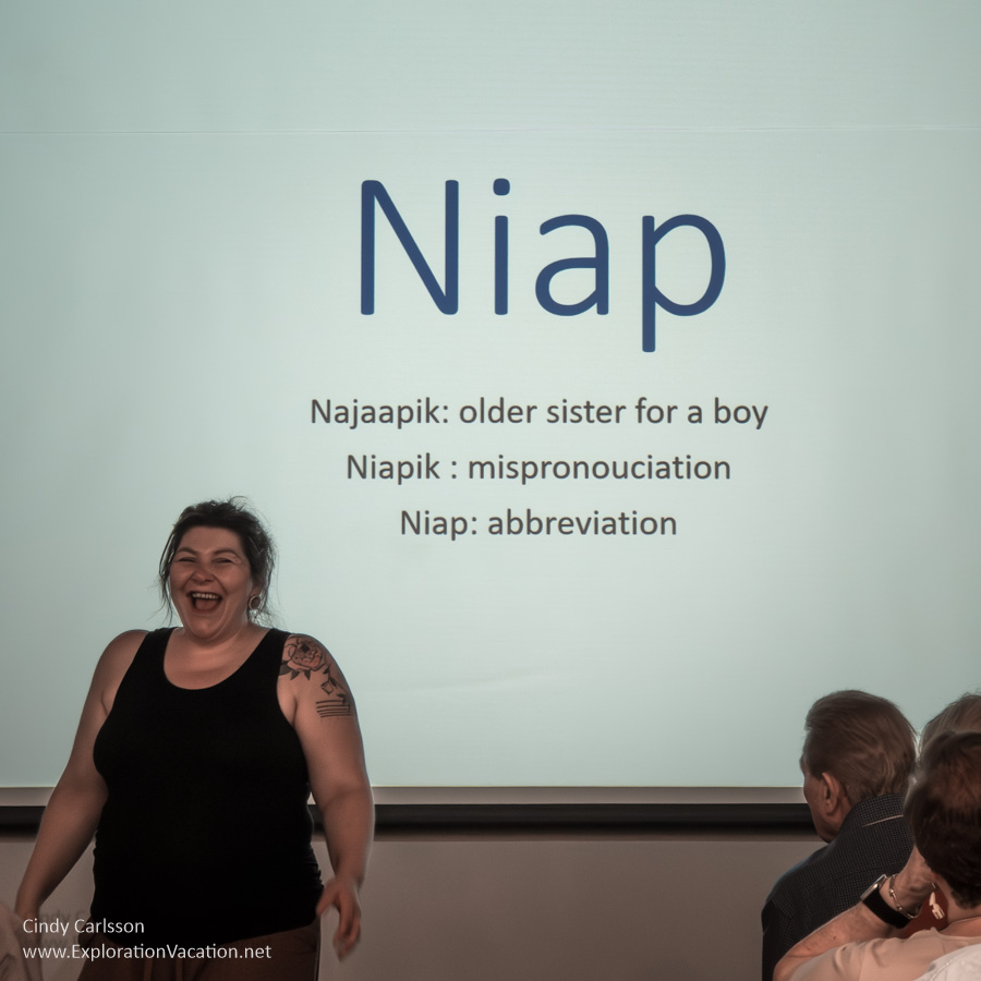 Photo of Inuit artist Niap with a screen that explains where the name she uses came from